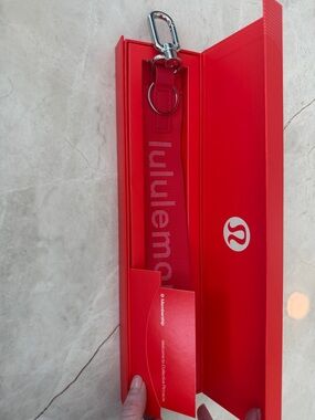 lululemon bright red logo wrist strap keychain
